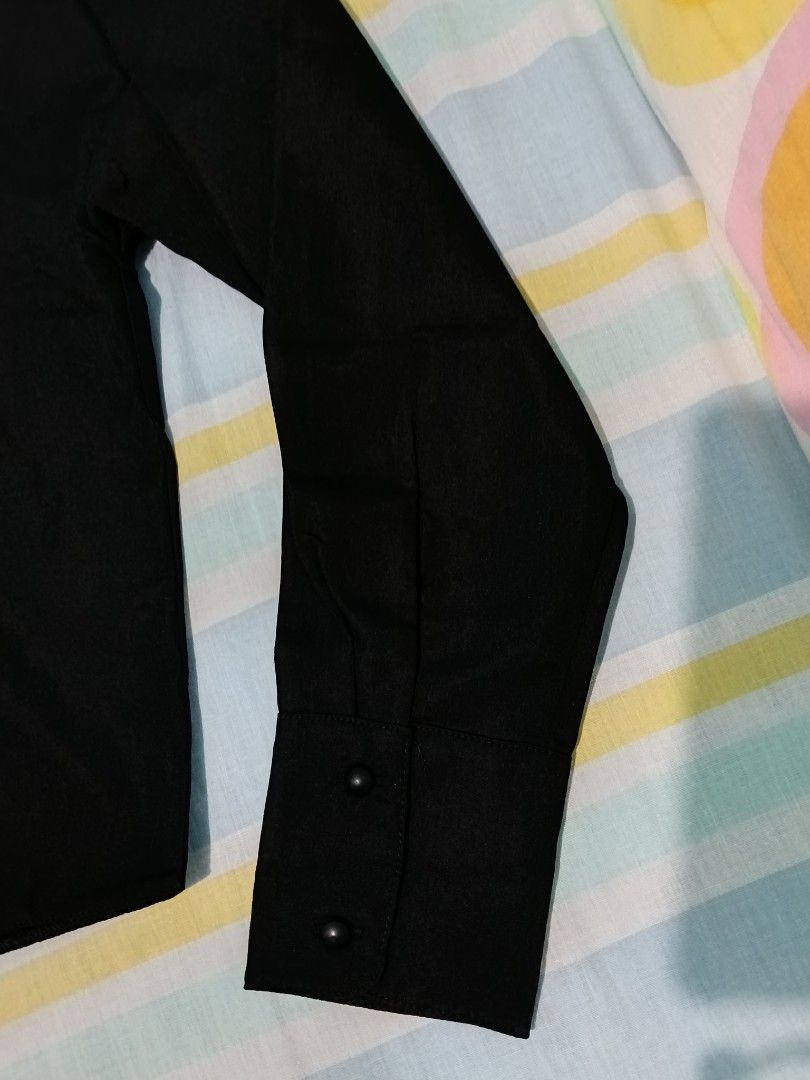 Plains & Prints Black Long Sleeve Blouse (Category: Longsleeves) located in Aroroy. Submitted by new_annette (Listing ID 1465982493, Image 3). Description: - Brand: Plains & Prints - Color: Classic Black - Style: Long sleeve blouse with collar and button cuffs - Details: Pearl and crystal decorative pins near the neckline, gold ribbon logo hardware on the back collar - Condition: Brand new with tag attached - Ideal for: Office wear, corporate eve