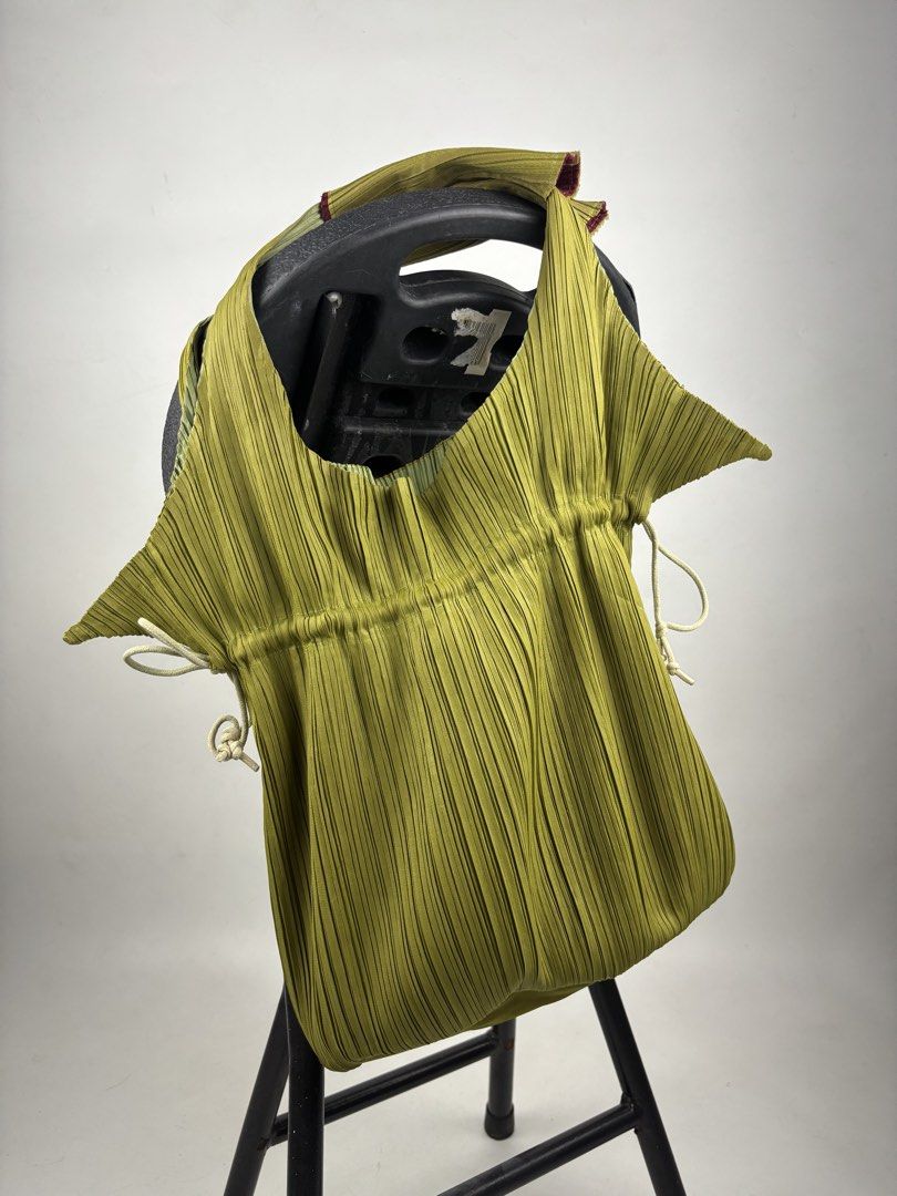 Pleats Please Issey Miyake Pleated Handbag (Category: Tote Bags) located in Makati City. Submitted by ragrepository (Listing ID 1465982318, Image 1). Description: Pleats Please Issey Miyake Pleated Handbag Height-13.5” Width- 11” Depth-4.5” Handle drop- 6.5” Condition-9/10 Flaw-Minor scratch .