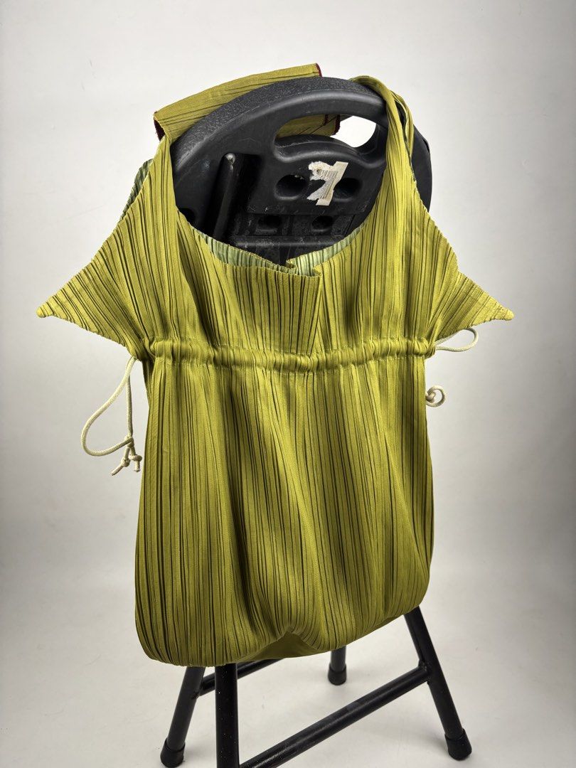 Pleats Please Issey Miyake Pleated Handbag (Category: Tote Bags) located in Makati City. Submitted by ragrepository (Listing ID 1465982318, Image 2). Description: Pleats Please Issey Miyake Pleated Handbag Height-13.5” Width- 11” Depth-4.5” Handle drop- 6.5” Condition-9/10 Flaw-Minor scratch .