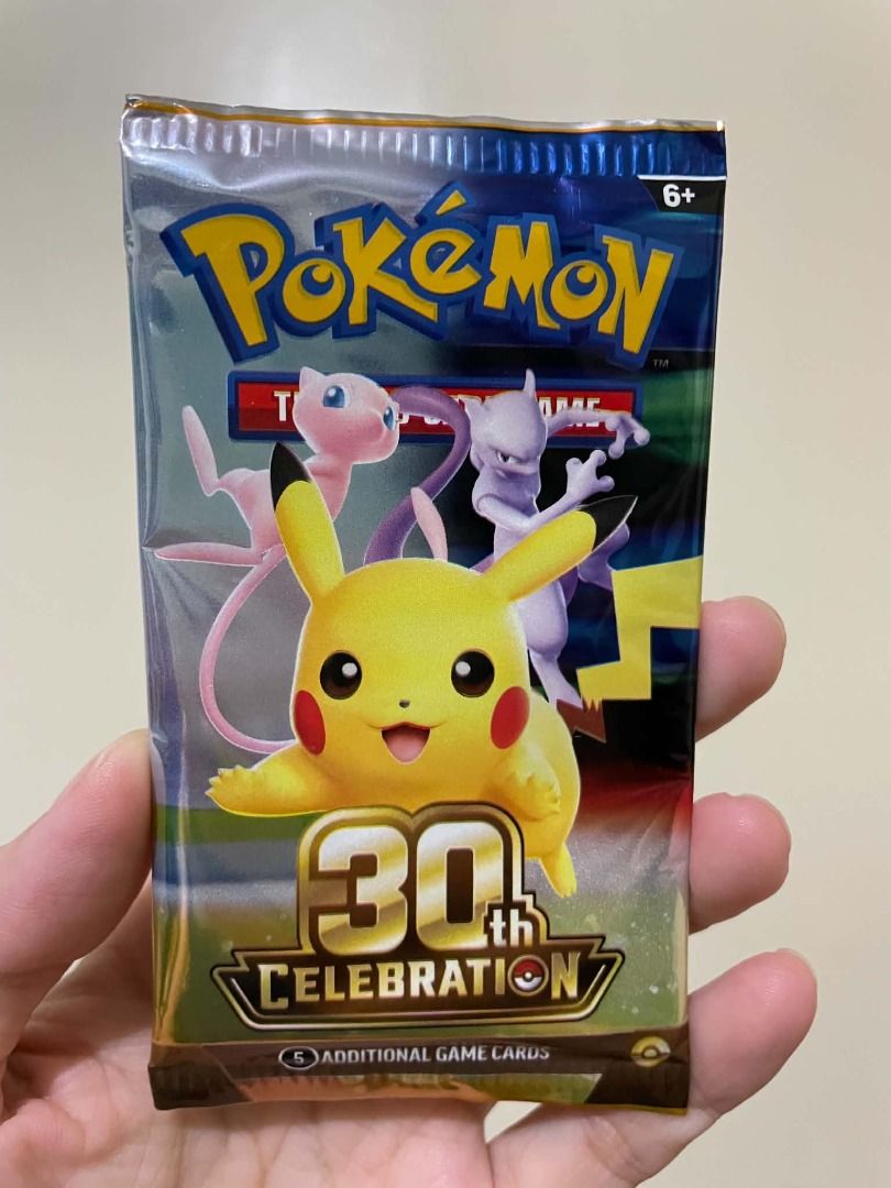 Pokémon 30th Celebration Booster Pack English (Category: Card Packs) located in Manila. Submitted by jco05 (Listing ID 1466089501, Image 1). Description: Sealed Pokémon 30th Celebration booster pack featuring iconic characters Pikachu, Mew, and Mewtwo on the front packaging. This special anniversary edition pack contains 5 additional game cards. The foil packaging remains in pristine, unopened condition, making it a fantastic addition for any col
