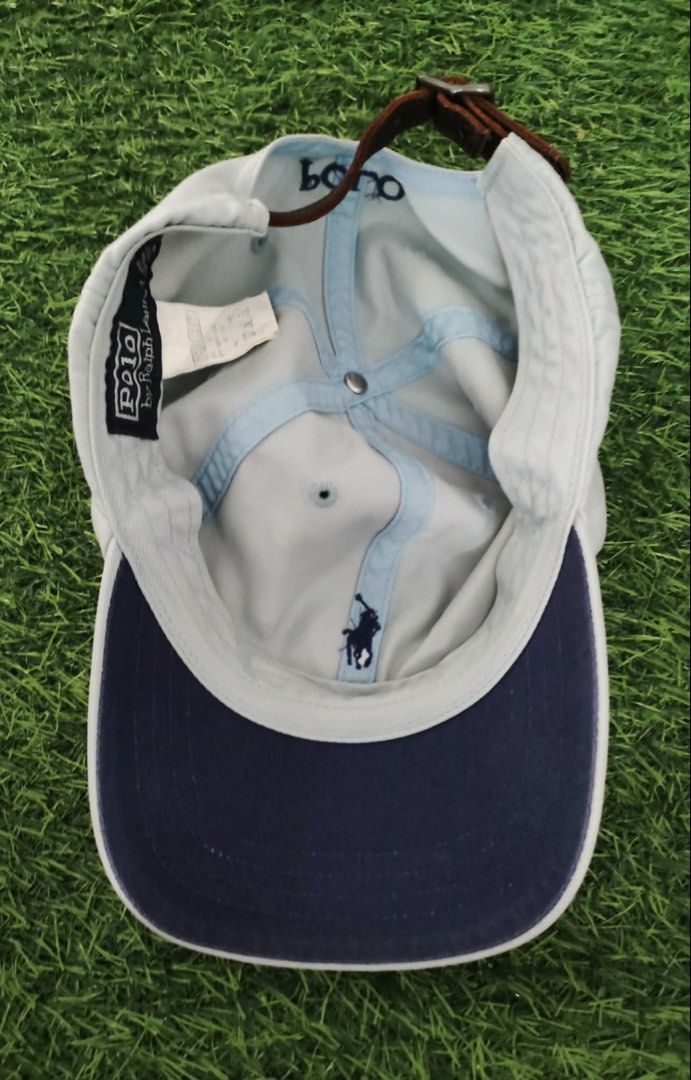 Polo Ralph Lauren Light Blue Baseball Cap (Category: Caps & Hats) located in Makati City. Submitted by rare_thrift_stuff (Listing ID 1465970630, Image 2). Description: - Brand: Polo Ralph Lauren - Color: Light blue with dark blue embroidered pony logo - Material: 100% cotton - Details: 'POLO' embroidered on the back, made in Taiwan tag inside - Closure: Adjustable brown leather strap with metal buckle - Condition: Excellent, stylish and ready to 