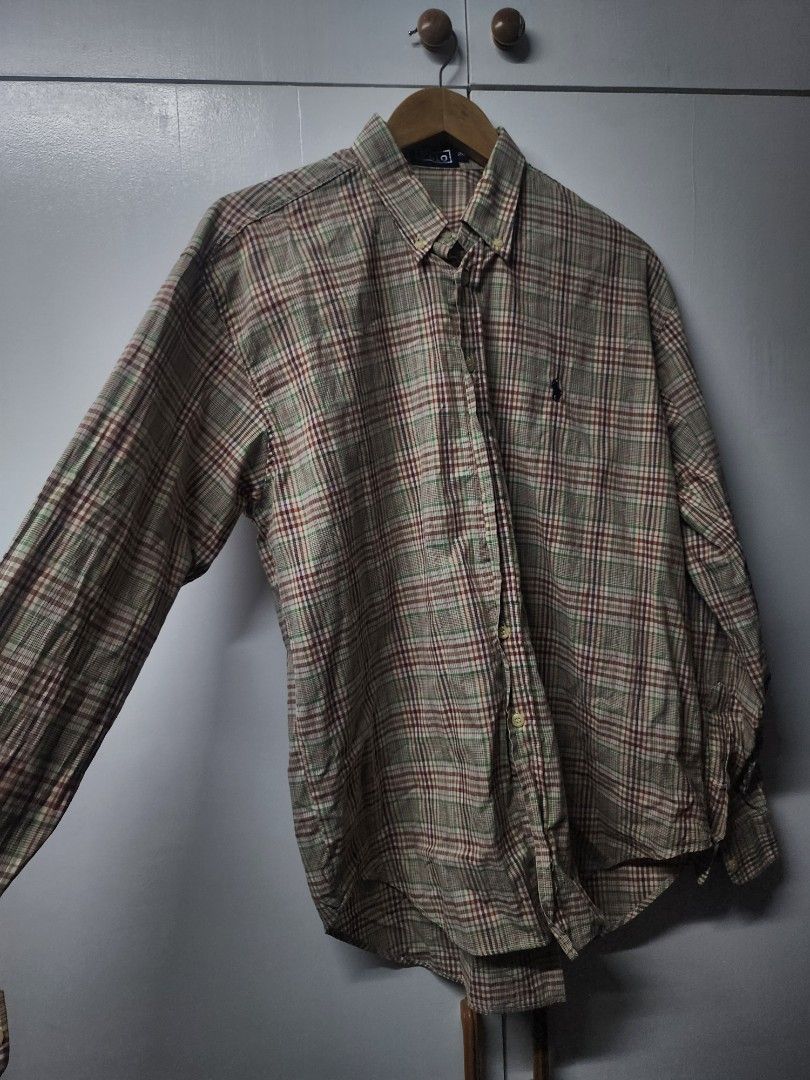 Polo Ralph Lauren Plaid Button-Down Shirt (Category: Tshirts & Polo Shirts ) located in Manila. Submitted by ybn15 (Listing ID 1466127642, Image 1). Description: - Brand: Polo Ralph Lauren - Design: Multi-color plaid (brown, green, red checks) - Details: Long sleeves, button cuffs, classic collar, embroidered pony logo on chest - Size: 20 - Condition: Clean, well-kept, and ready to wear.