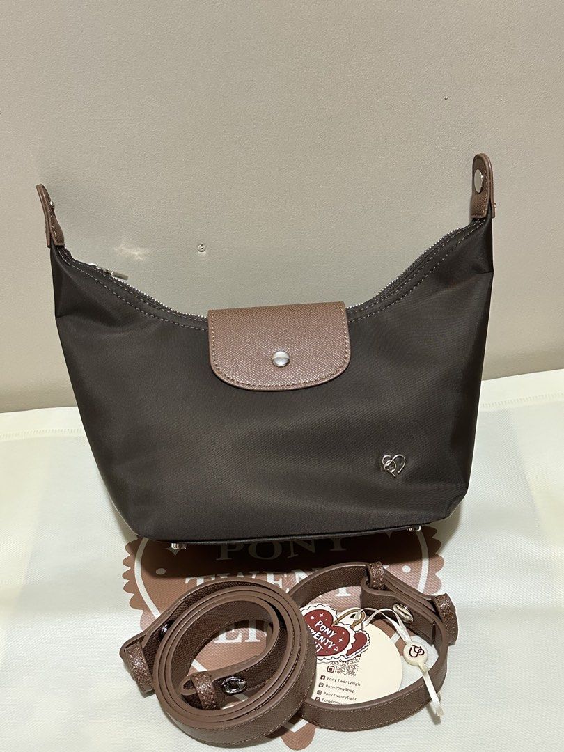 Pony Twentyeight Moya Nylon Bag (Small) (Category: Cross-body Bags) located in Caloocan City. Submitted by kyleangelurt (Listing ID 1466136826, Image 1). Description: FOR SALE: Pony Twentyeight Moya Nylon Bag (Small) ✨ Color: Choco ✨ Condition: Brand New ✨100% Original from 🇹🇭 Inclusions: ✔️ Short & Long Strap ✔️ Eco Bag & Dust Bag 🏷️ 1,500 💬 RFS: Decluttering 📍 Location: Sta. Cruz, Manila 🛵 Delivery: Lalamove 💌 PM for actual photos.
