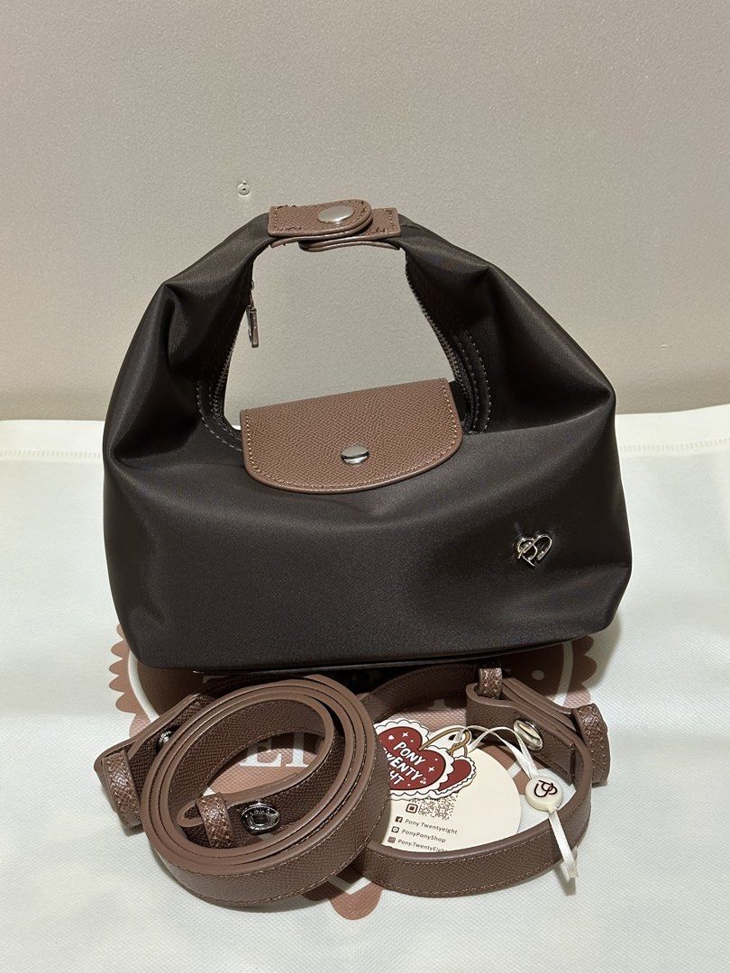 Pony Twentyeight Moya Nylon Bag (Small) (Category: Cross-body Bags) located in Caloocan City. Submitted by kyleangelurt (Listing ID 1466136826, Image 2). Description: FOR SALE: Pony Twentyeight Moya Nylon Bag (Small) ✨ Color: Choco ✨ Condition: Brand New ✨100% Original from 🇹🇭 Inclusions: ✔️ Short & Long Strap ✔️ Eco Bag & Dust Bag 🏷️ 1,500 💬 RFS: Decluttering 📍 Location: Sta. Cruz, Manila 🛵 Delivery: Lalamove 💌 PM for actual photos.