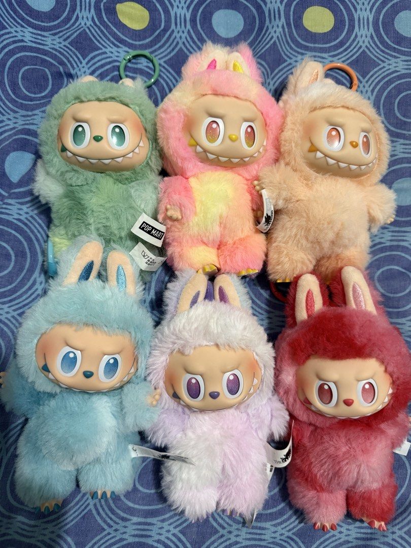 Pop Mart The Monsters Big into energy set (Category: Designer & Blind Box Toys) located in Talisay. Submitted by grazelle_1985 (Listing ID 1466048707, Image 1). Description: - Series: Pop Mart Labubu big into energy plush pendants - Quantity: 6 available (sell individually or as a set) - Colors: Green, pink, peach, blue, purple, and red - Features: Signature teeth, pointed ears, and built-in key ring - Condition: Brand new with side tags attached