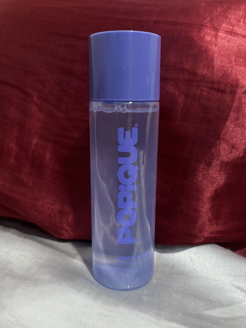Popique Take A Sip Multi-Peptide Toning Essence 145ml (Category: Face Care) located in Manila. Submitted by 444sky (Listing ID 1466108902, Image 3). Description: - Brand: Popique - Product: Take A Sip Multi-Peptide Toning Essence - Size: 145 ml / 4.9 fl. oz. - Benefits: Provides deep hydration and strengthens the skin barrier - Packaging: Clear formula in a purple bottle with matching cap - Perfect addition to your daily skincare routine.