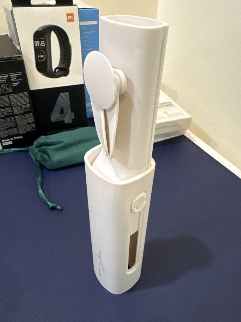 Portable fan (Category: Fans) located in Manila. Submitted by dobronxsglazer (Listing ID 1466053388, Image 2). Description: - Product: Portable Fan (Model: F-18) - Color: Clean White - Compact & pocket-friendly design, perfect for on-the-go cooling - Easy to use and store inside bags or pouches - No original packaging box - “WE LOVE STEVE” buy if u love steve ig - Micro USB cable included.