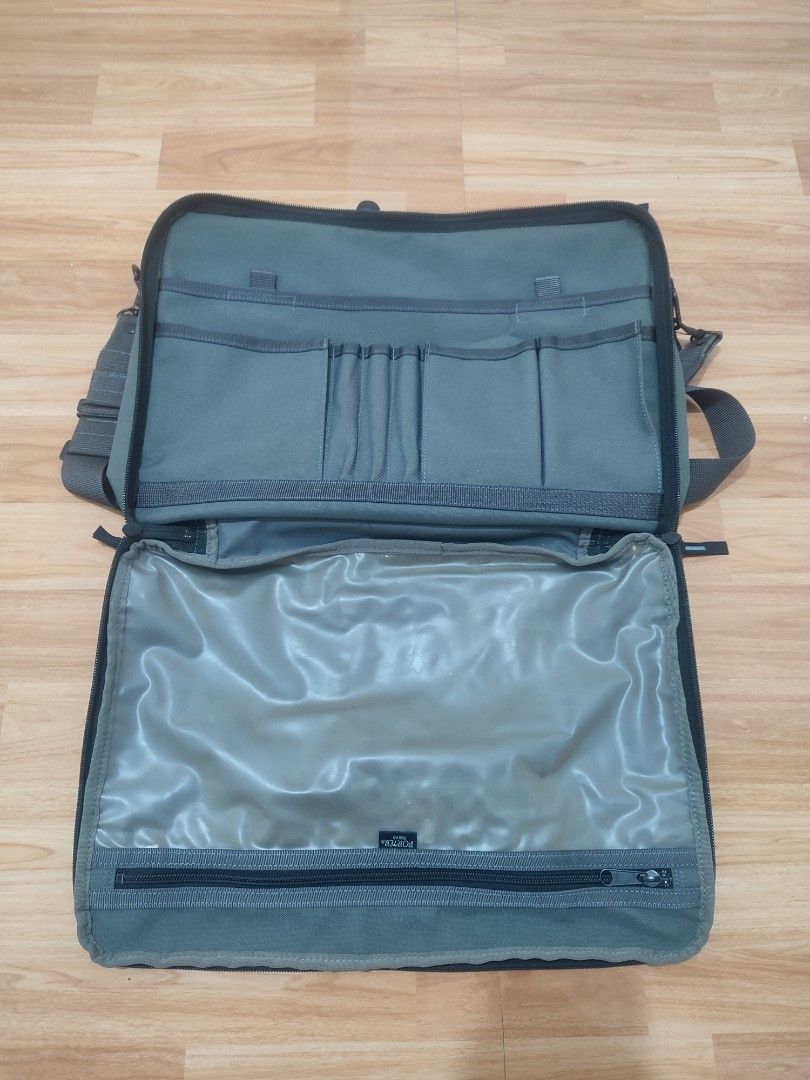 Porter Tokyo Yoshida & Co. Grey Briefcase Bag (Category: Briefcases) located in Lipa City. Submitted by gudoys_outdoor16 (Listing ID 1466081849, Image 3). Description: - Authentic Porter Tokyo Yoshida & Co. briefcase in versatile grey - Durable canvas construction with sturdy dual handles - Includes an adjustable shoulder strap with a comfortable padded guard - Multiple exterior and interior zippered compartments, slip pockets, and pen holders - 