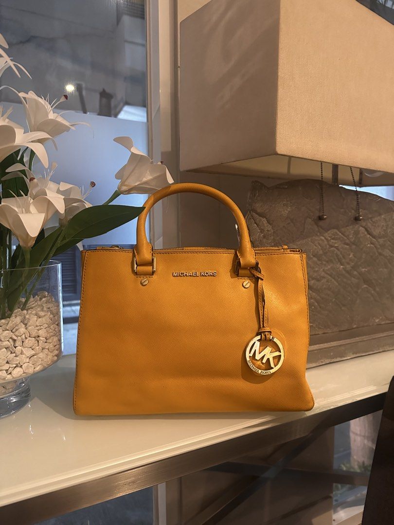 PRADA and Michael Kors Bundle! (Category: Luxury Bags & Wallets) located in Taguig. Submitted by d_archives.ph (Listing ID 1466050758, Image 2). Description: - Authentic Michael Kors handbag in bright yellow - Red Prada Top Hand Bag..