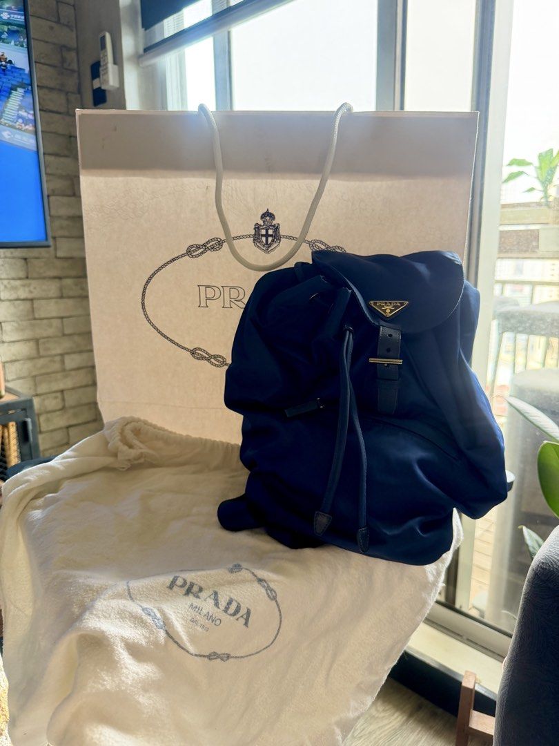 Prada Backpack Nylon - Blue (Category: Luxury Bags & Wallets) located in Pasig City. Submitted by ryanlim1515 (Listing ID 1466003519, Image 1). Description: ORIGINAL PRADA Nylon Backpack – Blue 💙 ✨ Lightly used Brand: Prada Item: Nylon Backpack Color: Blue Material: Nylon Condition: Like new Size: Medium size Authenticity: Guaranteed authentic Inclusions: [Dust bag / Paper bag] Details * Classic and timeless Prada nylon backpack * Lightweight an