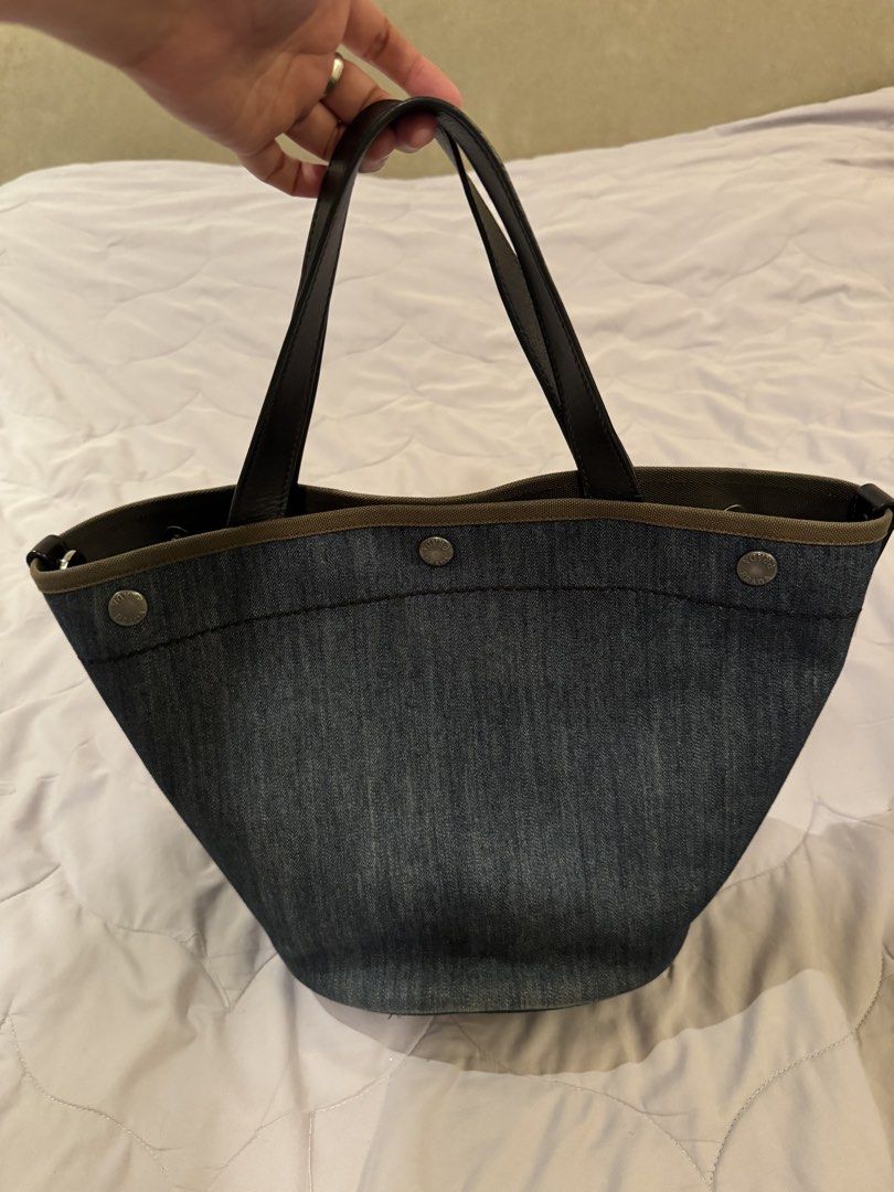 Prada denim Bucket bag (Category: Luxury Bags & Wallets) located in Pasay City. Submitted by iflyph (Listing ID 1466155232, Image 3). Description: - Authentic Prada bucket bag - denim - lightweight - Prada logo detail a bit faded 7/10 condition guaranteed authentic or money back no return no exchange.