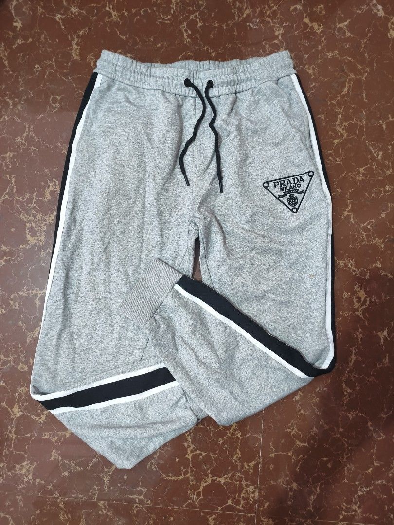 Prada Grey Sweatpants with Black Side Stripes (Category: Joggers) located in Paranaque City. Submitted by glendel_04 (Listing ID 1465978806, Image 3). Description: Good cond 9.8/10 Size 32-34 Need wash ✅.