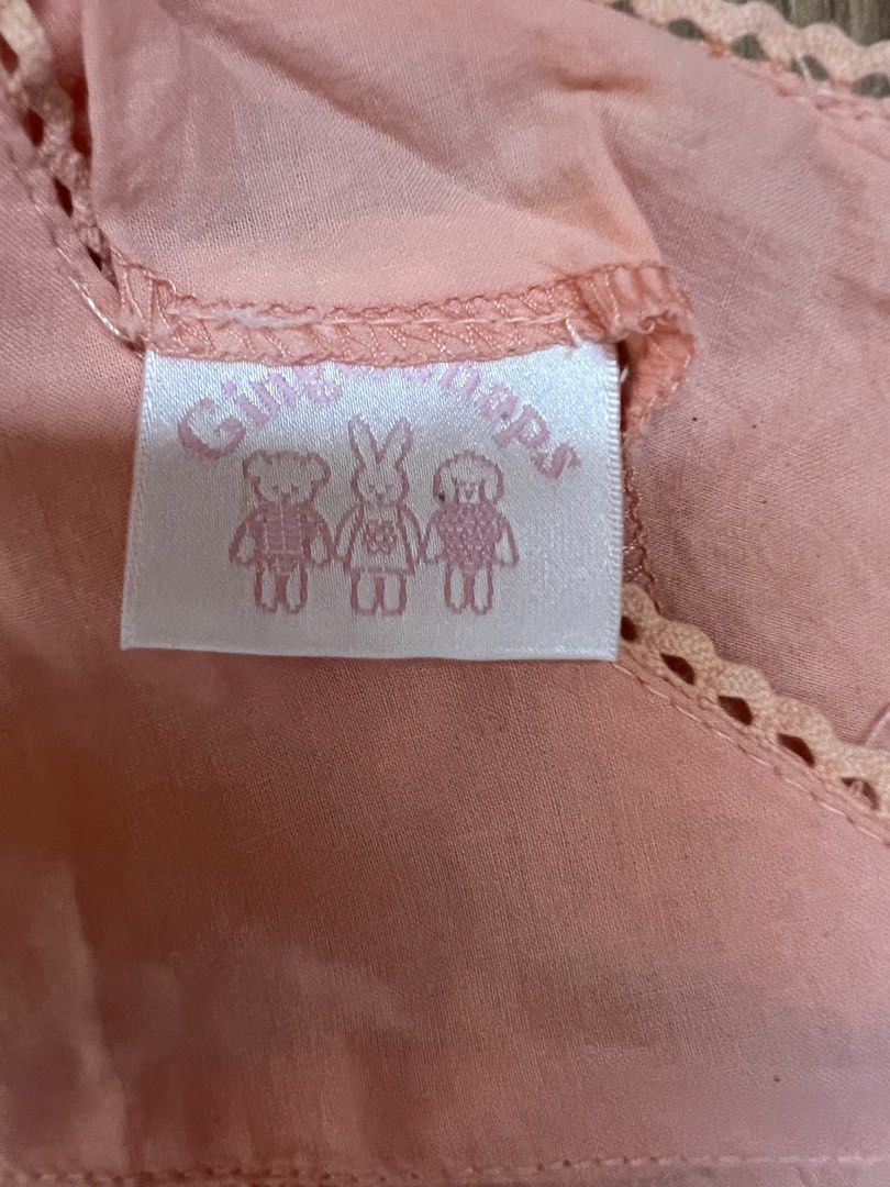 Preloved gingersnaps blouse and pants size 2 (Category: Babies & Kids Fashion) located in Cebu City. Submitted by carou75847 (Listing ID 1465997291, Image 3). Description: - Color: Peach pink - Size: 2 (Small) - Material: Soft, lightweight fabric - Design: V-neckline with delicate scallop lace trim - Condition: Excellent, clean stitching, no stains or damage - Style: Comfortable for everyday casual wear.