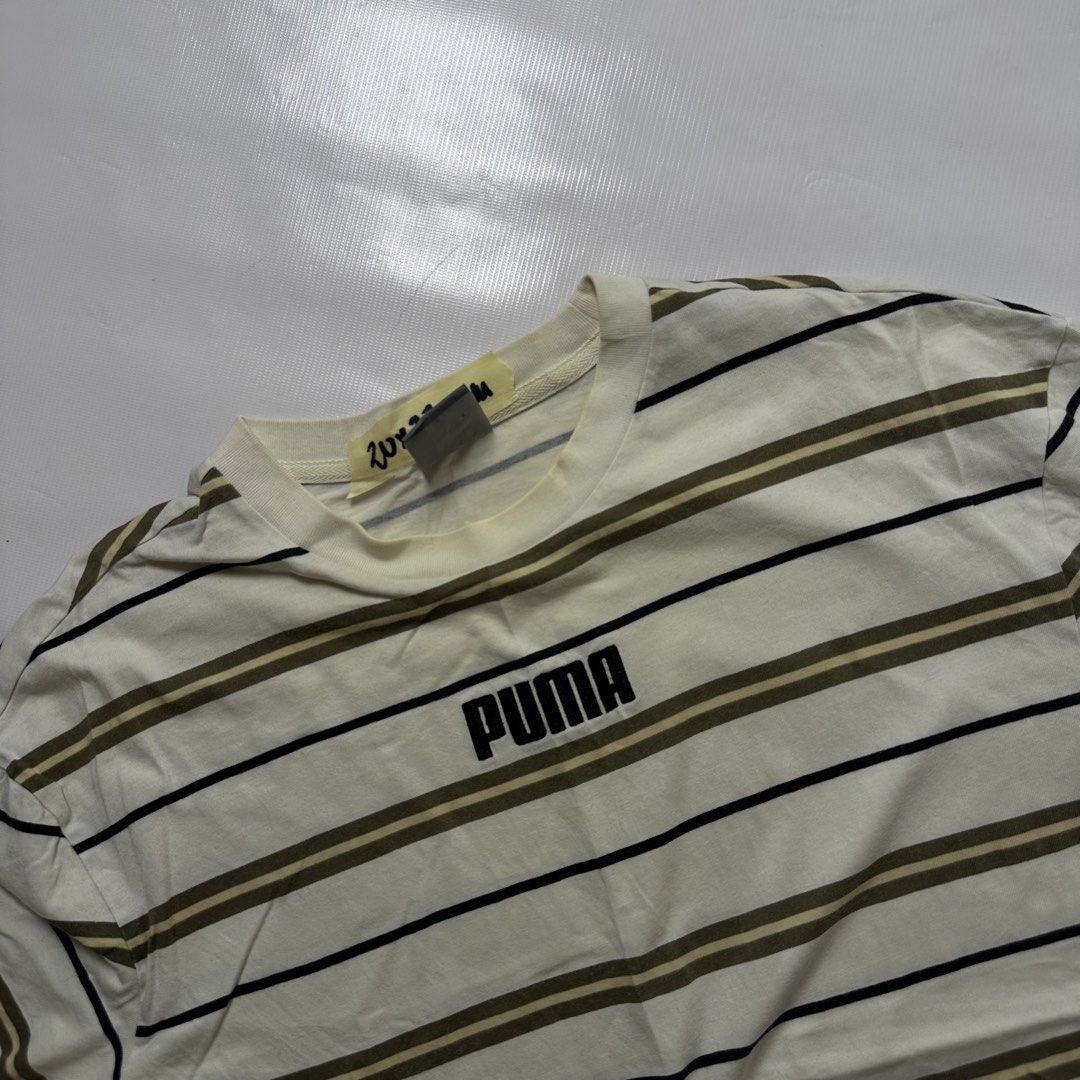 Puma Striped T-Shirt (Category: Tshirts & Polo Shirts ) located in Gapan. Submitted by rasthriftshop (Listing ID 1466123102, Image 2). Description: PUMA Size on tag: M Dimes: 20 x 27 ₱350 + sf Condition: Excellent Color rate: 9/10 Issue: None.