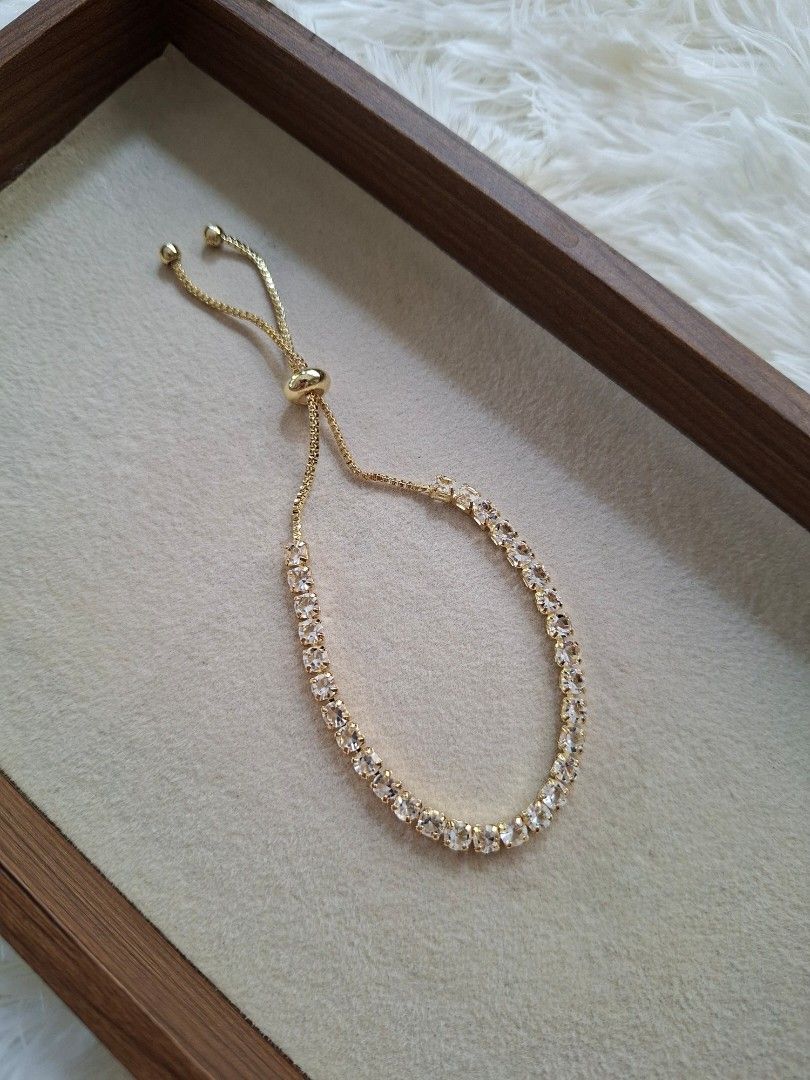 Push and Pull Square Stones Drawstring Zirconia Gold Stainless Bracelet (Category: Bracelets) located in Dasmarinas. Submitted by danabrie22 (Listing ID 1466030829, Image 3). Description: very well-made, excellent crafstmanship 10/10 condition brand new zinc alloy & white-colored cubic zirconia stones made in Hongkong.