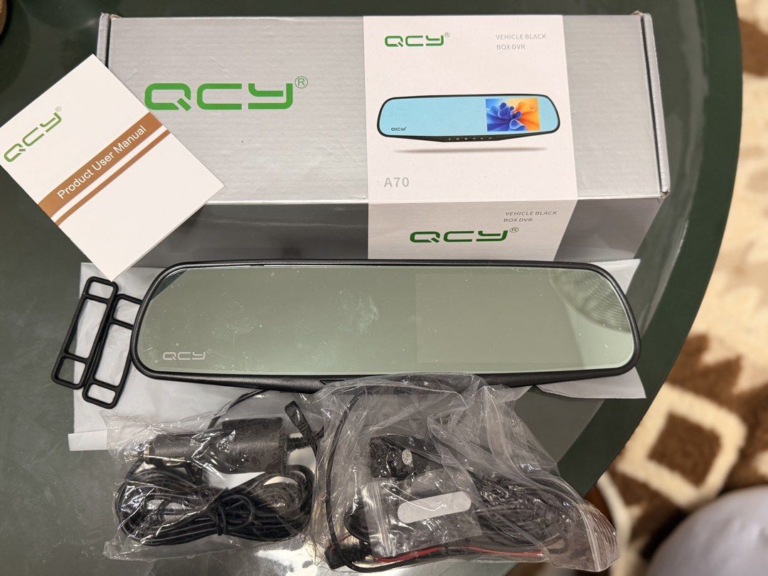 QCY A70 Vehicle Black Box DVR Mirror Camera (Category: Cameras) located in Mandaluyong City. Submitted by classymissy014 (Listing ID 1466142684, Image 1). Description: - Model: QCY A70 Vehicle Black Box DVR (Rearview mirror style dashcam) - Condition: Complete set with built-in display screen - Inclusions: Original box, user manual, power cables, wiring accessories, and mounting straps - Status: All components laid out and ready for setup 📍manda