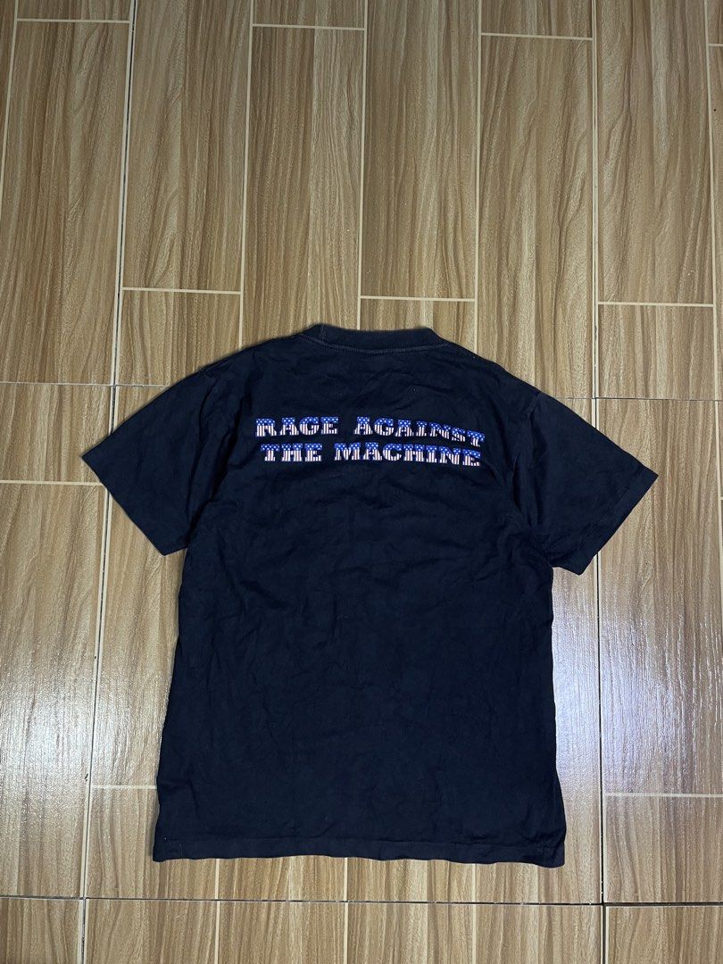 Vintage Rage Against the machine (Category: Activewear) located in Naga. Submitted by black-market00 (Listing ID 1466126504, Image 2). Description: Width 19 Lenght 25 Minimal hairline.