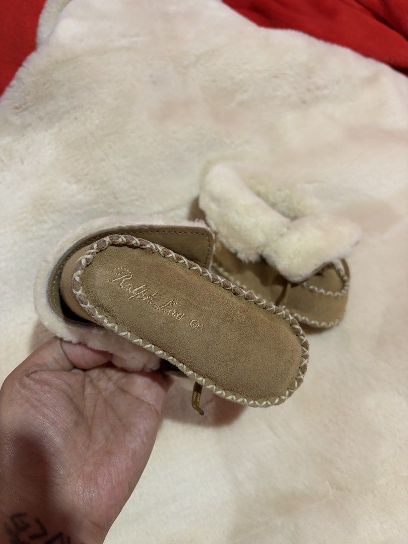 Ralph Lauren Baby Suede Shearling Booties (Category: Babies & Kids Fashion) located in Manila. Submitted by kindledph_ (Listing ID 1466023509, Image 2). Description: RFS: Decluttering - Authentic Ralph Lauren baby booties - Premium brown suede material with soft white faux shearling lining - Adorable lace-up bow detail on top - Signature embroidered logo on the side - Suede sole with embossed logo lettering - Keeps tiny feet warm, cozy, and styli