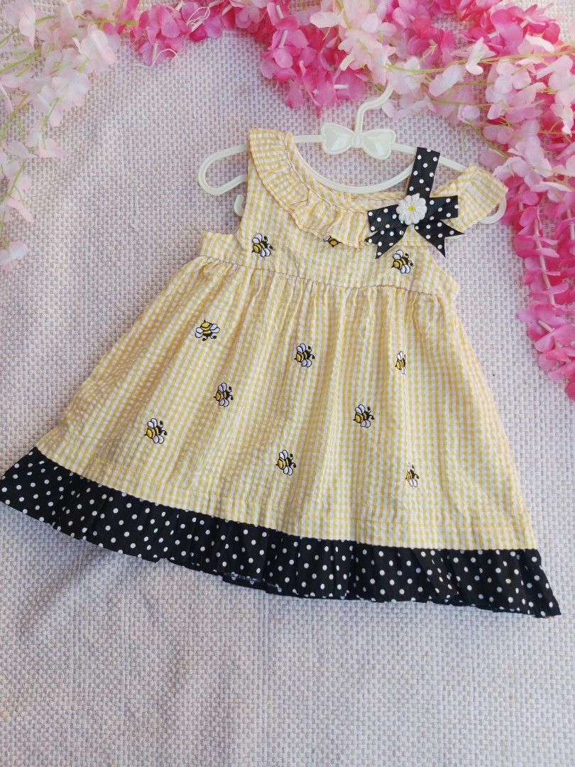 Rare Edition Bumblebee Dress (Category: Babies & Kids Fashion) located in Sipocot. Submitted by mszari (Listing ID 1465995339, Image 1). Description: Rare Editions Bumblebee Gingham Baby Dress (Size 6-9M) Price: ₱450 (OPEN FOR OFFER) Description: 🐝 Adorable Embroidered Bee Dress 🐝 • Brand: Rare Editions • Size: Infant 6-9 Months • Color: Sunny Yellow and White Gingham / Black Polka-Dot • Design: Sweet ruffle collar with a tiny black bow, scatte