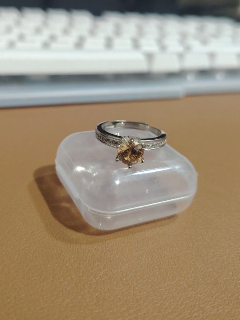 Moissanite Amber-Colored ring (Category: Rings) located in Caloocan City. Submitted by cherishedfinds (Listing ID 1466112373, Image 1). Description: - Tested Moissanite Ring (pass diamond tester) - Adjustable - 18K white gold plated - Non-tarnish, no fade under normal condition and storage -Perfect for dummy engagement/wedding ring - Spent 500, get a freebie 🎁 You may add items from my other listings 💯.