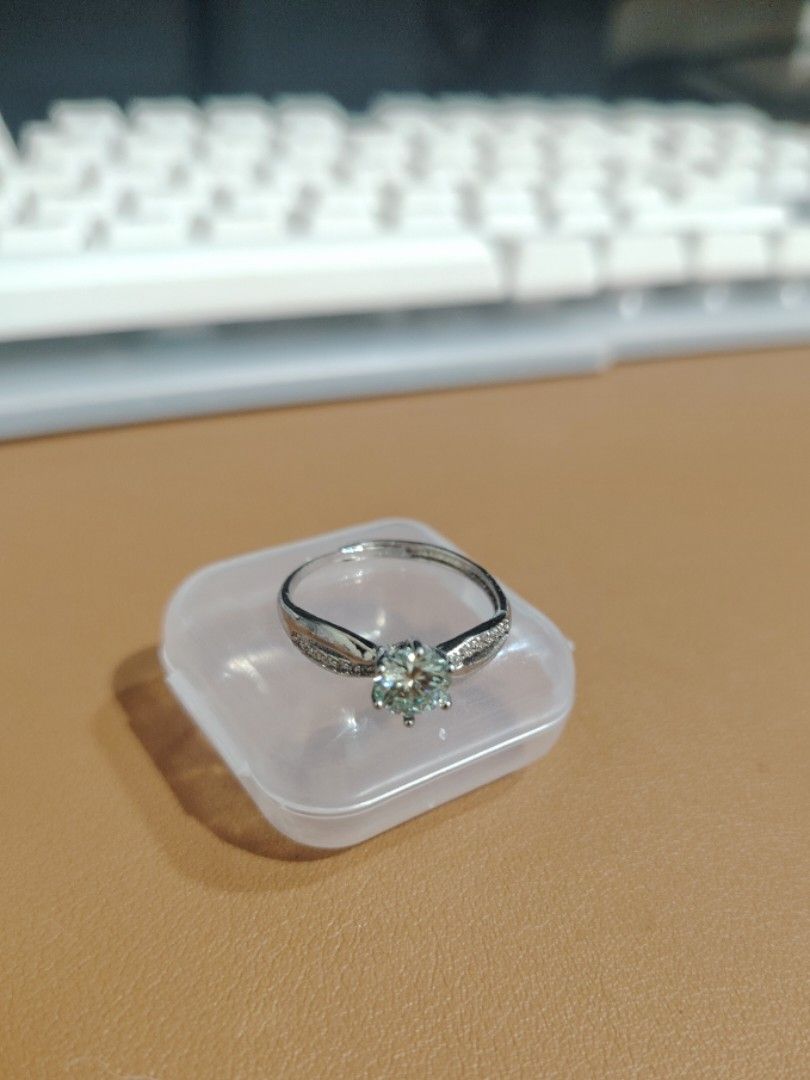 Moissanite Bluish colored ring (Category: Rings) located in Caloocan City. Submitted by cherishedfinds (Listing ID 1466113762, Image 3). Description: - Tested Moissanite ring (pass diamond tester) - Adjustable - 18K White Gold plated, non tarnish non fade under proper care - Perfect for dummy engagement/wedding ring - Spend 500, get a freebie 🎁 You may add items from my other listings 💯.