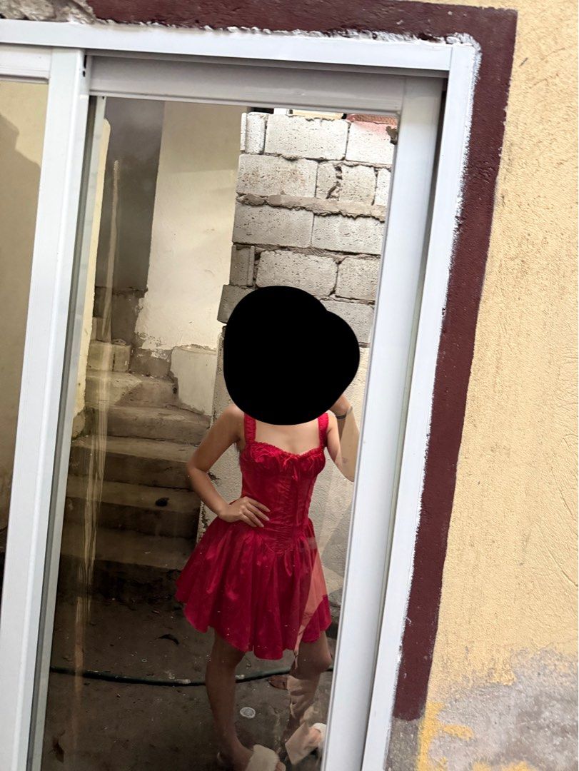 Red Corset Style Mini Dress (Category: Dresses) located in Manila. Submitted by ulan_9 (Listing ID 1465961246, Image 3). Description: - Color: Bright red - Style: Corset bodice with structured paneling, front tie detail, and flared skater skirt - Straps: Shoulder straps included - Condition: Worn a couple of times for photos, still in great shape - Best for: Parties, clubbing, and nights out.