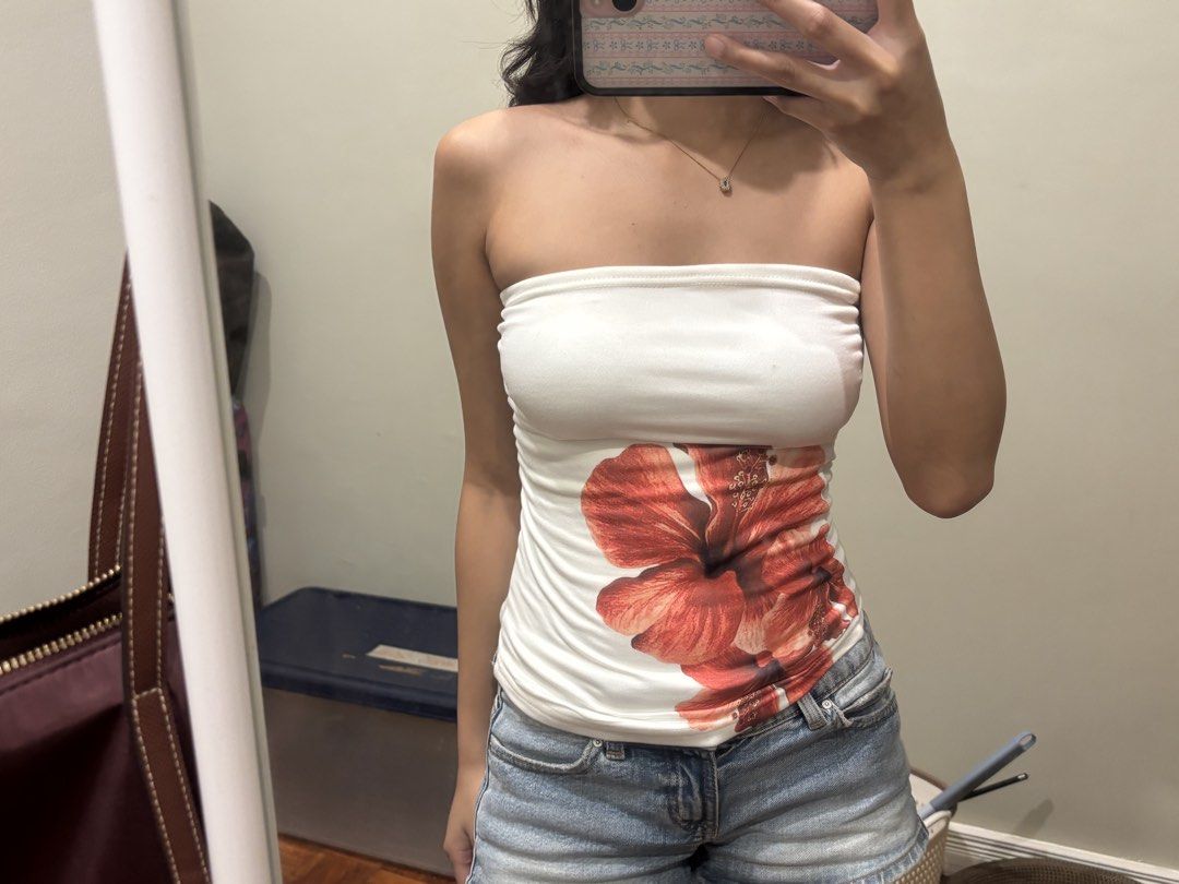 Red flower fitted tube top (Category: Sleeveless) located in Paranaque City. Submitted by domisclosett (Listing ID 1466091572, Image 2). Description: - Fitted white tube top w/ red flower design - Cute fit and can be worn other way around!! loc: parañaque/muntinlupa area mop: gcash, maribank, gotyme mod: lalamove or j&t, sf c/o buyer.