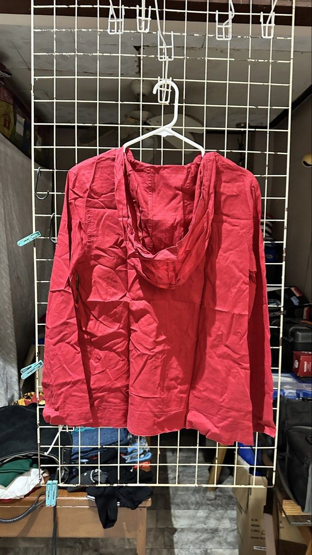 Red Long Sleeve Hoodie with Button Placket (Category: Coats, Jackets and Outerwear) located in Quezon City. Submitted by nsseller (Listing ID 1466109740, Image 2). Description: - Color: Bright red - Material: Lightweight woven fabric - Fit: Standard fit (regular size) - Features: Half-button placket, attached hood - Style: Simple and casual - Condition: Has minor storage wrinkles, needs a quick wash or iron.