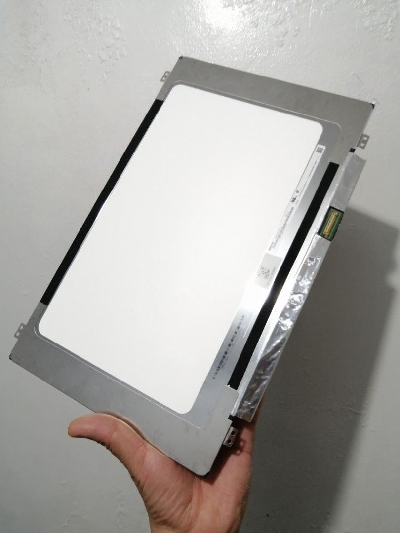 Replacement Laptop LCD 14" 30 pins Screen Panel (Category: Laptops & Notebooks) located in Quezon City. Submitted by ricoav (Listing ID 1466152718, Image 2). Description: -I can send video proof of working - Replacement LCD 14" 30 pins panel for laptops - Matte black front finish with silver metal casing and connector ribbon on back - Perfect spare part for repairing broken or cracked laptop screens - Standard slim notebook display module - Impor