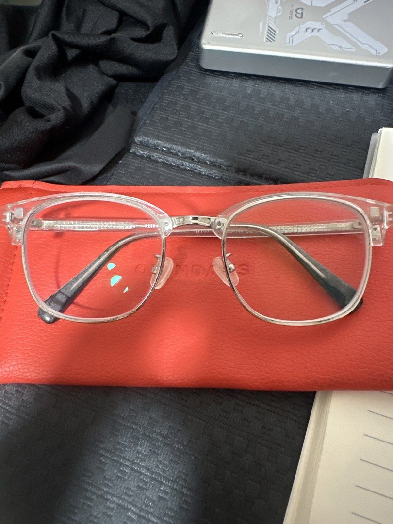 RETRA x OJO transparent eyeglasses (Category: Sunglasses & Eyewear) located in Quezon City. Submitted by camille96 (Listing ID 1465961899, Image 1). Description: - Brand: RETRA x OJO collaboration - Frame: Clear acetate with silver metal bridge and details - Temples: Black tips, lightweight and comfortable for everyday wear - Graded lenses.