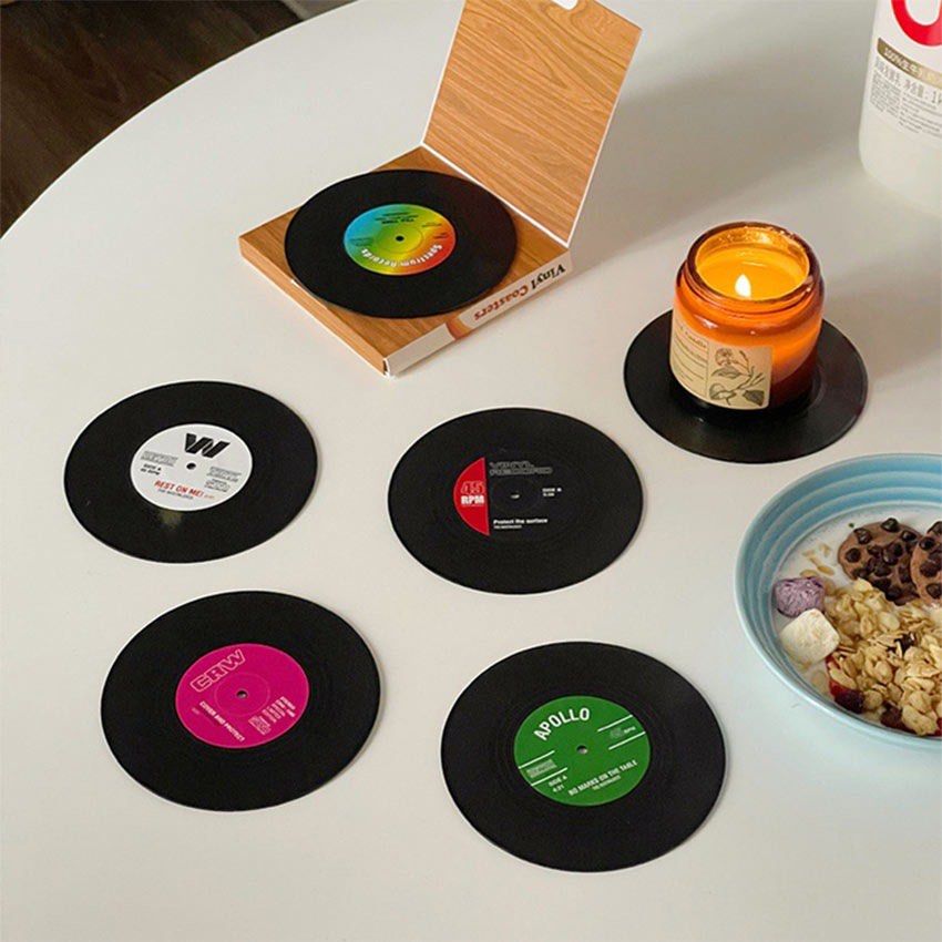 Retro Vinyl Record Coasters Set with Storage Box (Category: Vinyls) located in Paranaque City. Submitted by jujudeclutterss (Listing ID 1466150651, Image 2). Description: - Set of 6 unique drink coasters styled like classic mini vinyl records - Features colorful center label designs on each coaster - Comes with a cool record player-style storage sleeve box - Effectively protects tabletops from mug rings and water drops - Perfect and unique gift f