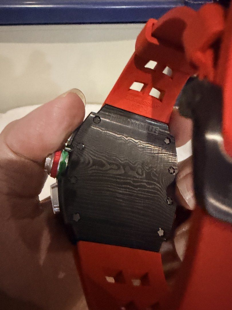 Richard Mille RM 65-01 Automatic Split-Seconds Chronograph (Category: Luxury Watches) located in Quezon City. Submitted by BAYMAX72 (Listing ID 1465975711, Image 3). Description: - Model: Richard Mille RM 65-01 Automatic Split-Seconds Chronograph - Case: Carbon TPT with signature layered texture - Strap: Vibrant red rubber with secure buckle closure - Dial: Multi-layered skeleton with detailed sub-dials and luminous hands - Movement: Swiss-made a