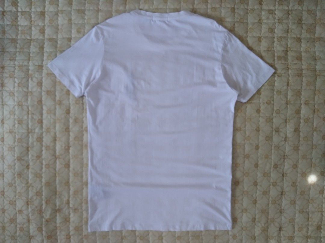 RL Big Pony White T-shirt (Category: Tshirts & Polo Shirts ) located in Zamboanga. Submitted by zhumhazhav (Listing ID 1466039906, Image 2). Description: A white Polo Ralph Laureen crewneck T-shirt. Featuring a contrasting dark/Navy big Pony embroidered logo on the left chest. Taga size large best fit to medium Width 19.5 Length 28 In good condition Check all photos for details 650+shipping fee.