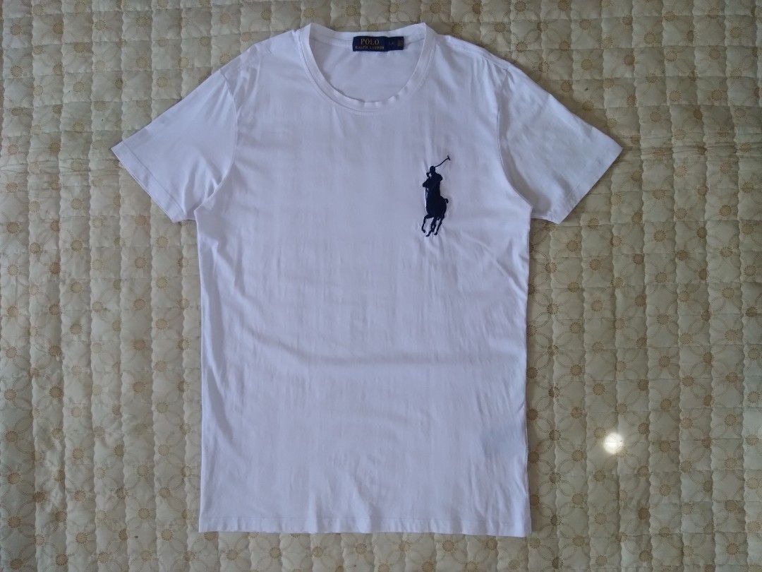 RL Big Pony White T-shirt (Category: Tshirts & Polo Shirts ) located in Zamboanga. Submitted by zhumhazhav (Listing ID 1466039906, Image 1). Description: A white Polo Ralph Laureen crewneck T-shirt. Featuring a contrasting dark/Navy big Pony embroidered logo on the left chest. Taga size large best fit to medium Width 19.5 Length 28 In good condition Check all photos for details 650+shipping fee.