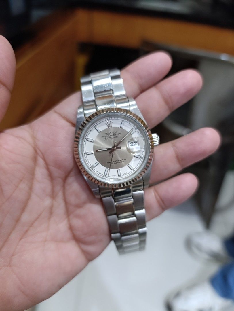 Rolex Oyster Perpetual Datejust Watch (Category: Luxury Watches) located in Manila. Submitted by zealbear_c92344 (Listing ID 1466119350, Image 2). Description: - Model: Rolex Oyster Perpetual Datejust - Dial: Silver with Roman numerals and date window with cyclops lens - Bezel: Iconic fluted bezel - Bracelet: Stainless steel Oyster bracelet (fits standard wrist size) - Movement: Reliable automatic movement, keeping good time - Condition: Pre-owne