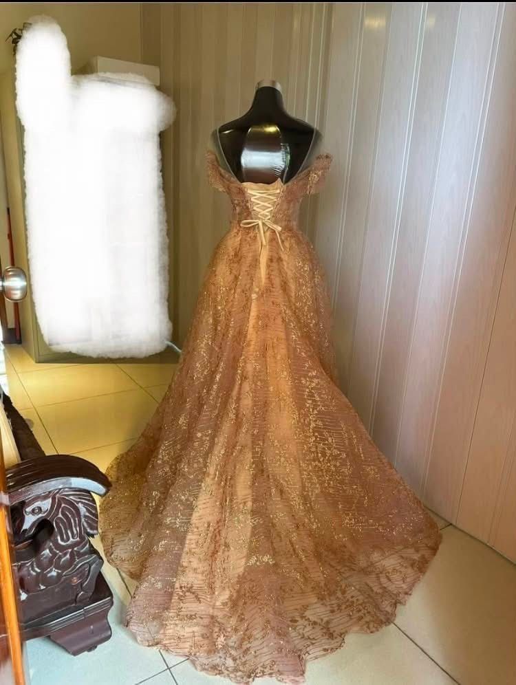 Rose Gold Ball Gown (Category: Evening dresses & gowns) located in Quezon City. Submitted by shanepenguin (Listing ID 1466103452, Image 2). Description: - Pearl and sequin embroidery detailing the bodice and neckline - Sheer tulle with shimmering metallic gold glitter patterns - Adjustable lace-up ribbon corset closure in the back for a perfect fit - Worn only once - Size Bust: 33-45 in Waist: 20-35 in Hips: 30-45 in.