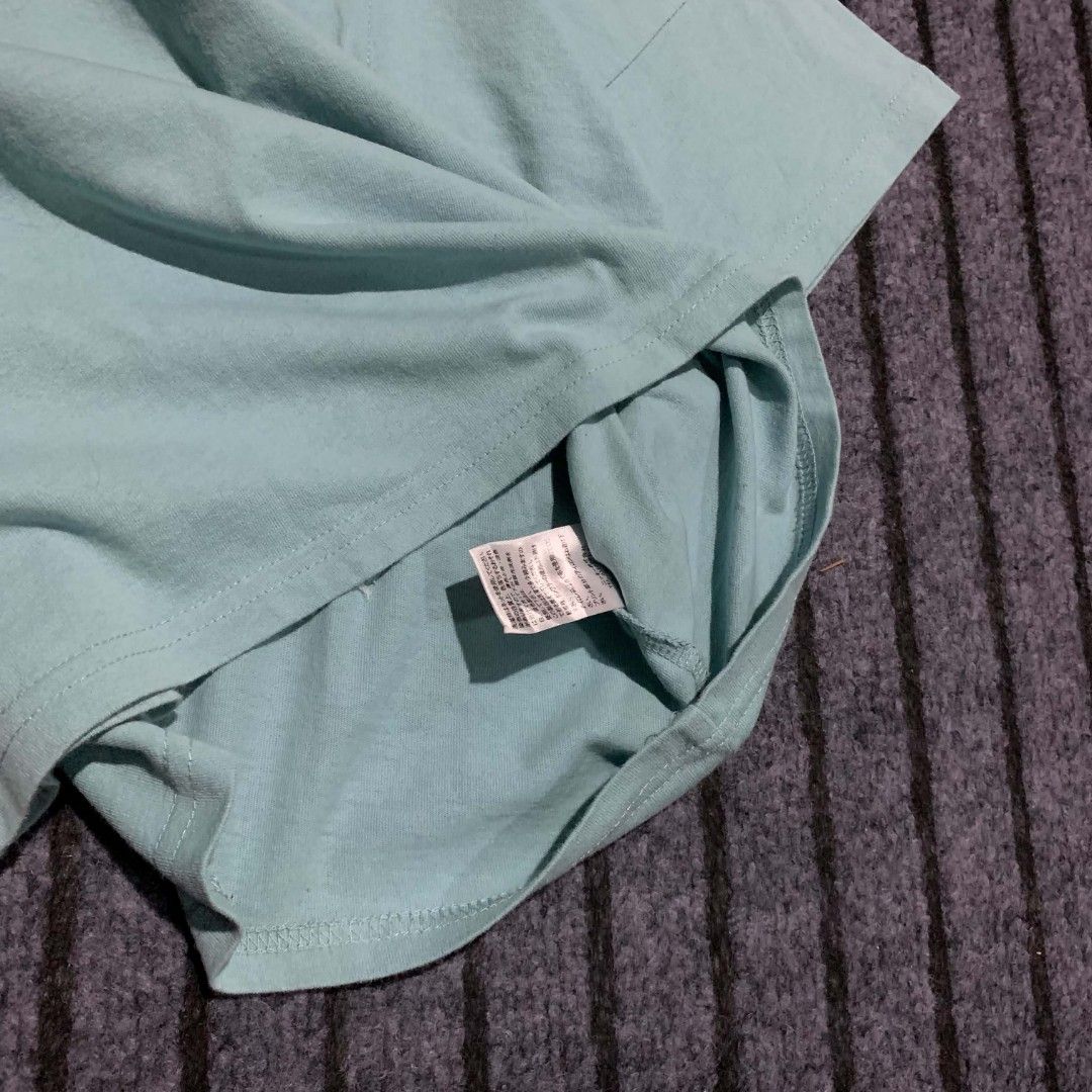 Rusty Surf Supply Co. T-Shirt - Blue (Category: Shirts) located in Bulacan. Submitted by lzl_thriftfinds (Listing ID 1446494648, Image 3). Description: - Brand: Rusty - Color: Blue - Size 18W x 19L - Features: Front pocket with Rusty logo - Back graphic: Smiley face with text 'Rusty Surf Supply Co. Since 1985 Surfboards' - Ideal for: Casual wear.