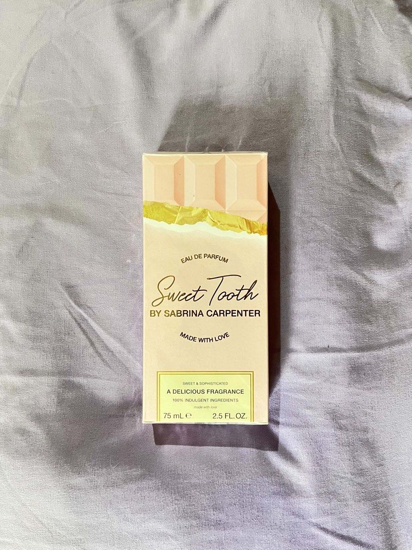 Sabrina Carpenter Sweet Tooth Eau De Parfum 75ml (Category: Fragrance & Deodorants) located in Manila. Submitted by aubss.1601 (Listing ID 1466074351, Image 1). Description: - Brand: Sabrina Carpenter - Fragrance: Sweet Tooth Eau de Parfum - Size: 75 ml / 2.5 fluid ounces - Scent Profile: Delicious gourmand fragrance with rich chocolate and sweet notes - Condition: Brand new, 100% authentic, and still sealed in its original cardboard packaging - 