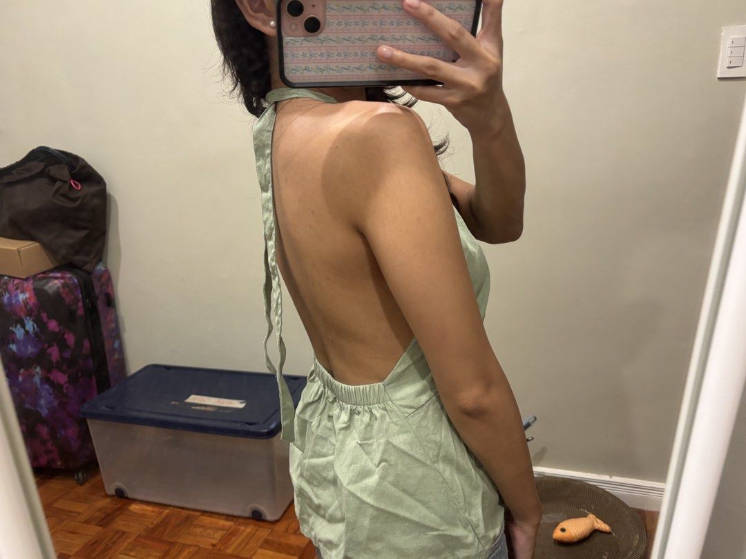 Sage green linen halter top (Category: Sleeveless) located in Paranaque City. Submitted by domisclosett (Listing ID 1466090458, Image 3). Description: - Color: Sage green - Design: Halter neck, V-neck, and open back - Features: Adjustable tie-neck straps, gathered bodice, and elasticized back waistband - Fabric: Lightweight linen - sorry a little wrinkled but will be ironed! loc: parañaque/muntinlupa area mop: gcash, maribank, gotyme mod: lalamov