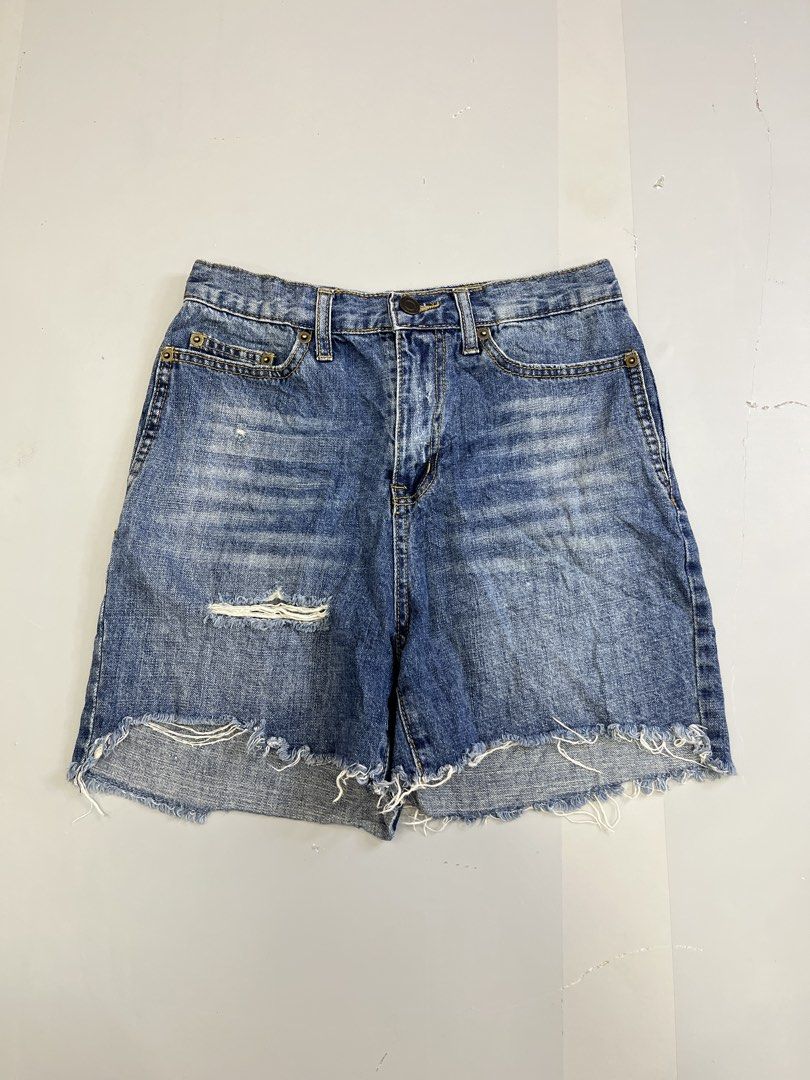 Saint Laurent Distressed Denim Shorts Size 26 (Category: Shorts) located in Mabalacat. Submitted by aas_thriftfings (Listing ID 1465991686, Image 1). Description: - Brand: Saint Laurent - Size: 26 (inner label) - Color/Wash: Medium blue - Details: Distressed with front rips and back pocket wear - Hem: Raw frayed bottom - Closure: Button fly with branded hardware - Style: Classic five-pocket design - Condition: Excellent pre-loved condition - Mode