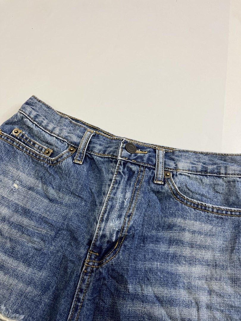 Saint Laurent Distressed Denim Shorts Size 26 (Category: Shorts) located in Mabalacat. Submitted by aas_thriftfings (Listing ID 1465991686, Image 3). Description: - Brand: Saint Laurent - Size: 26 (inner label) - Color/Wash: Medium blue - Details: Distressed with front rips and back pocket wear - Hem: Raw frayed bottom - Closure: Button fly with branded hardware - Style: Classic five-pocket design - Condition: Excellent pre-loved condition - Mode