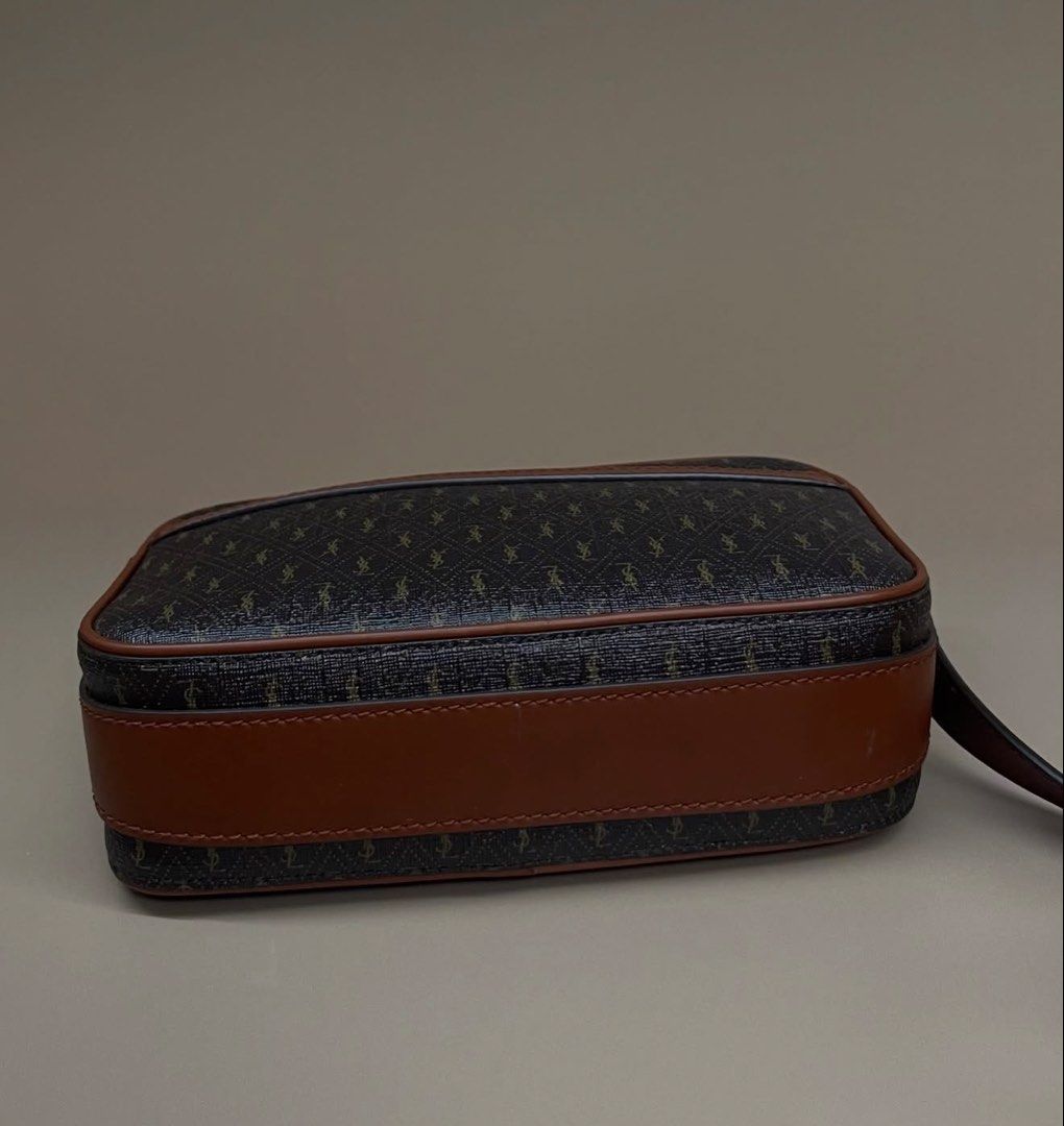 Saint Laurent YSL Monogram All Over Camera Bag (Category: Luxury Bags & Wallets) located in Makati City. Submitted by mit_z_g (Listing ID 1466053775, Image 2). Description: - Brand: Saint Laurent - Style: Camera Bag - Material: Dark brown monogram canvas with smooth tan leather trim - Hardware: Gold-tone - Closure: Top zip - brand New Condition - Inclusions: Black YSL dust bag, box - Strap: Matching adjustable strap.