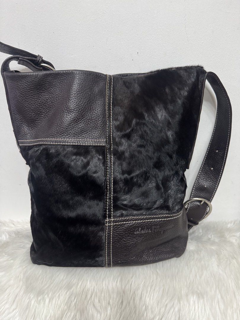 Salvatore Ferragamo patchworked shoulder bag (Category: Tote Bags) located in Malolos. Submitted by urban_thrift_09 (Listing ID 1466059168, Image 1). Description: -vintage Salvatore Ferragamo patchworked shoulder bag crafted from a combination of grained dark brown leather and black pony hair (calf hair). -It features prominent white contrast stitching that blocks out the textured panels, an adjustable leather shoulder strap with a silver-toned b