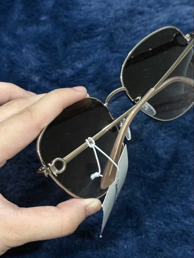 Salvatore Ferragamo Sunglasses with Tag (Category: Sunglasses & Eyewear) located in Manila. Submitted by snowflakesi (Listing ID 1465970146, Image 2). Description: - Frame: Classic metal design with signature Gancio hardware at the hinges - Lenses: Dark gradient for stylish sun protection - Perfect for daily wear or gifting Helping my ninang sell authentic sunglasses. ☀️ .