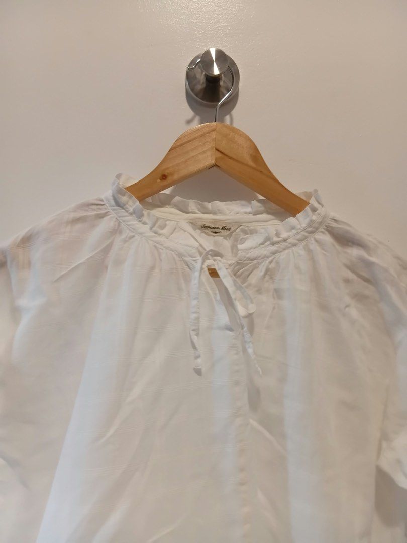 Samansa Mos2 White Ruffle Neck Blouse L-XL (Category: Blouses) located in Antipolo. Submitted by wisecat.4a7eea (Listing ID 1466041666, Image 2). Description: - Brand: Samansa Mos2 - Color: White with textured plaid pattern - Size: Fits L to XL (Relaxed fit) - Details: Ruffle collar with adjustable ribbon tie - Style: Great for casual everyday wear - Condition: Excellent.