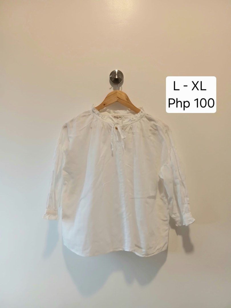 Samansa Mos2 White Ruffle Neck Blouse L-XL (Category: Blouses) located in Antipolo. Submitted by wisecat.4a7eea (Listing ID 1466041666, Image 1). Description: - Brand: Samansa Mos2 - Color: White with textured plaid pattern - Size: Fits L to XL (Relaxed fit) - Details: Ruffle collar with adjustable ribbon tie - Style: Great for casual everyday wear - Condition: Excellent.
