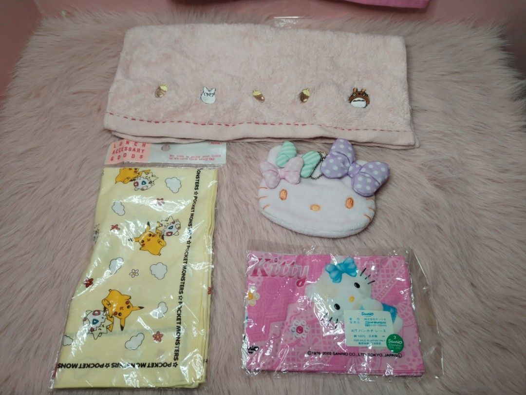 Sanrio and Pokemon character towel and accessory bundle (Category: Character Goods) located in Paombong. Submitted by eandj.shop (Listing ID 1466045239, Image 2). Description: 🎀 Sanrio Kitty plush tissue holder 🎀 Kitty pink patterned handkerchief 🎀 Pokemon yellow lunch cloth .