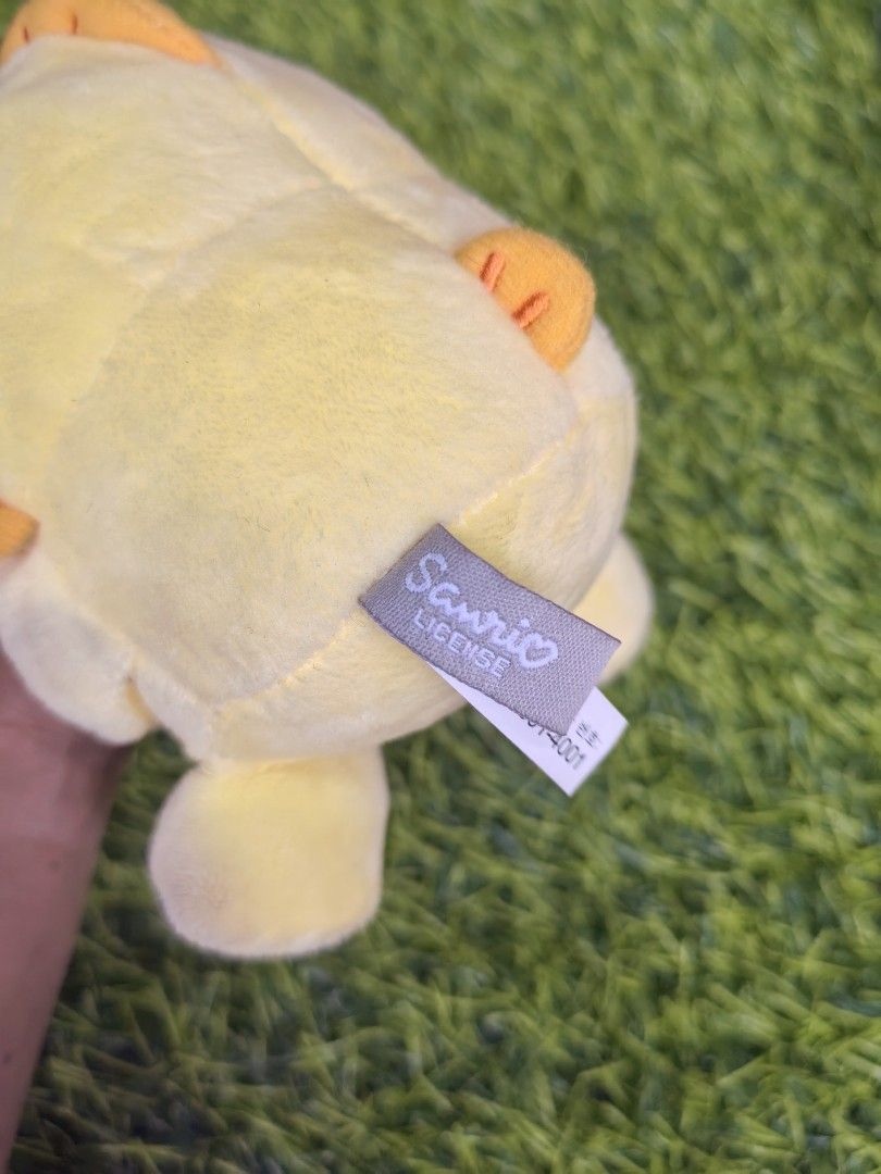 Sanrio Licensed Yellow Duck Character Plush Keychain (Category: Plushies & Soft Toys) located in Paranaque City. Submitted by furugiyafinds (Listing ID 1466035764, Image 3). Description: - Official Sanrio Licensed plush keychain - Adorable yellow bird design with embroidered facial details - Features a vibrant orange beak and matching feet - Equipped with a sturdy yellow plastic clip for easy hanging.