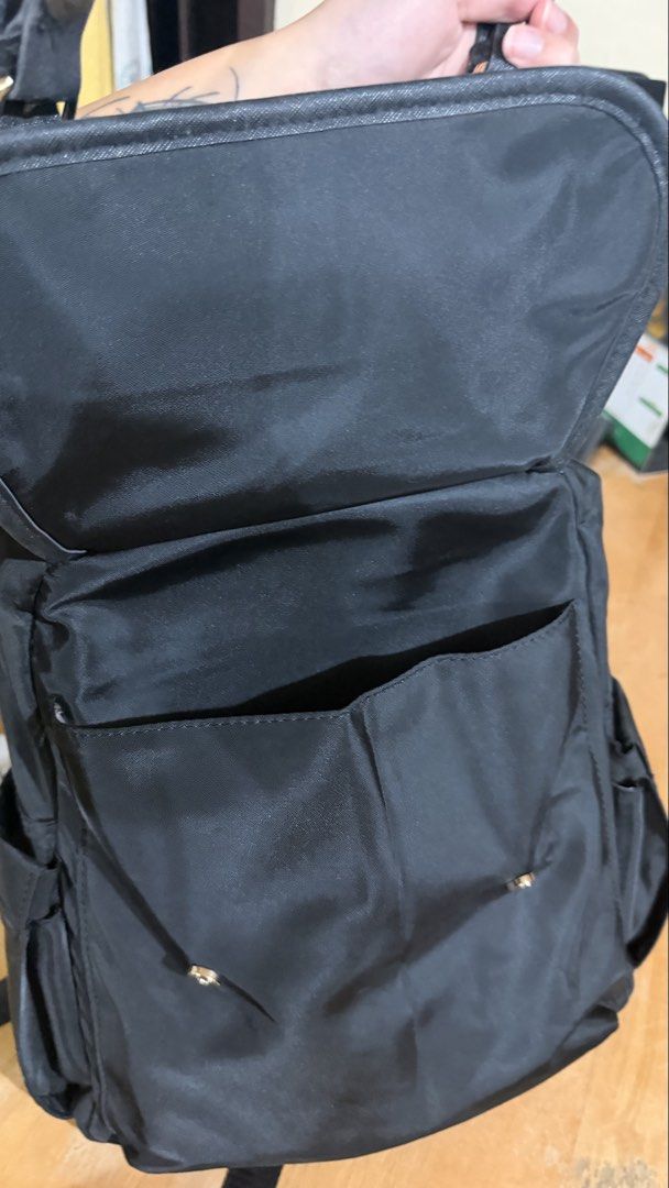 Secosana Black Backpack with Gold Hardware (Category: Backpacks) located in Manila. Submitted by swiftdragon.6d8469 (Listing ID 1466065845, Image 2). Description: - Brand: Secosana - Material: Durable black nylon with gold-tone hardware -Adjustable shoulder straps.