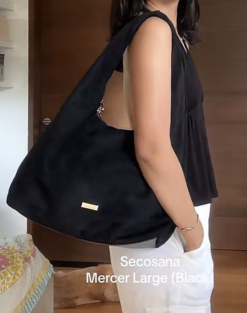 Secosana Mercer Large Black Shoulder Bag (Category: Shoulder Bags) located in Digos. Submitted by itseller03 (Listing ID 1466151961, Image 2). Description: NEVER BEEN USED - Already out of stock in the market. - Brand/Model: Secosana Mercer Large Shoulder Bag - Material & Finish: Sleek black suede texture - Hardware: Elegant gold-tone accents and minimalist front branding plate - Capacity: Roomy hobo silhouette with great space for daily essentia